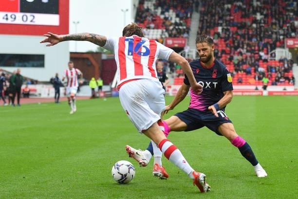 Philip Zinkernagel of Nottingham Forest tackles Ben Wilmot of Stoke City during the Sky Bet Championship match between Stoke City and Nottingham...