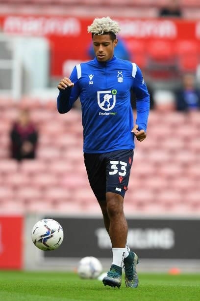 Lyle Taylor of Nottingham Forest warms up ahead of kick-off during the Sky Bet Championship match between Stoke City and Nottingham Forest at the...