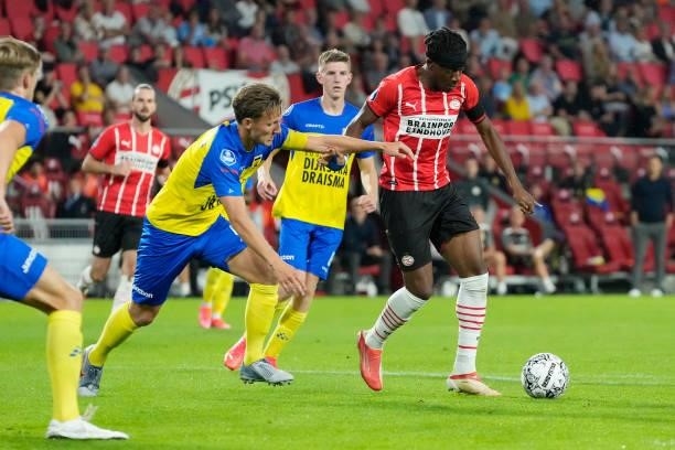 Erik Schouten of SC Cambuur, Noni Madueke of PSV scores his goal to make it 3-0 during the Dutch Eredivisie match between PSV v SC Cambuur at the...