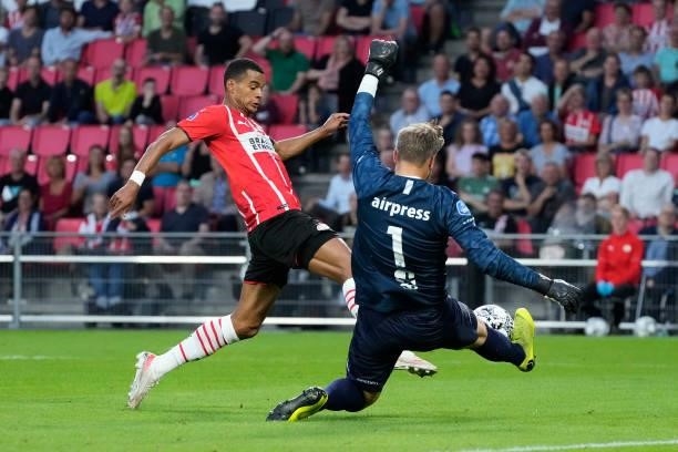 Cody Gakpo of PSV, Sonny Stevens of SC Cambuur during the Dutch Eredivisie match between PSV v SC Cambuur at the Philips Stadium on August 21, 2021...