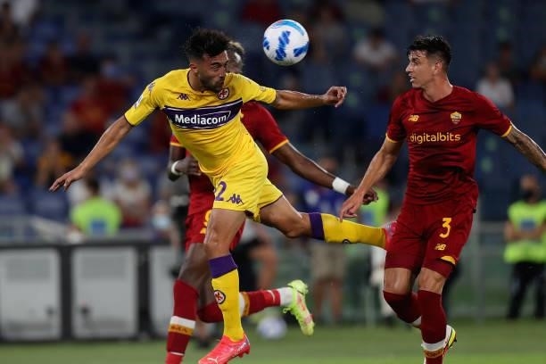 Nicolas Gonzalez of ACF Fiorentina competes for the ball with Roger Ibanez of AS Roma during the Serie A match between AS Roma v ACF Fiorentina at...