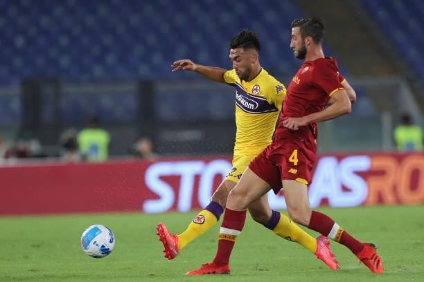Nicolas Gonzalez of ACF Fiorentina competes for the ball with Bryan cristante of AS Roma during the Serie A match between AS Roma v ACF Fiorentina at...
