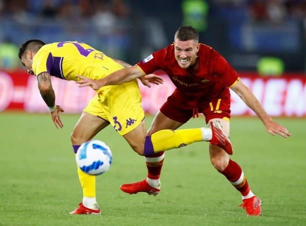Lorenzo Venuti of ACF Fiorentina and Jordan Veretout of AS Roma battle for the ball during the Serie A match between AS Roma and ACF Fiorentina at...