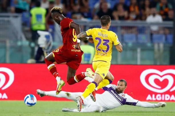 Bartlomiej Dragowski of ACF Fiorentina fouls Tammy Abraham of AS Roma and gets the red card during the Serie A match between AS Roma and ACF...