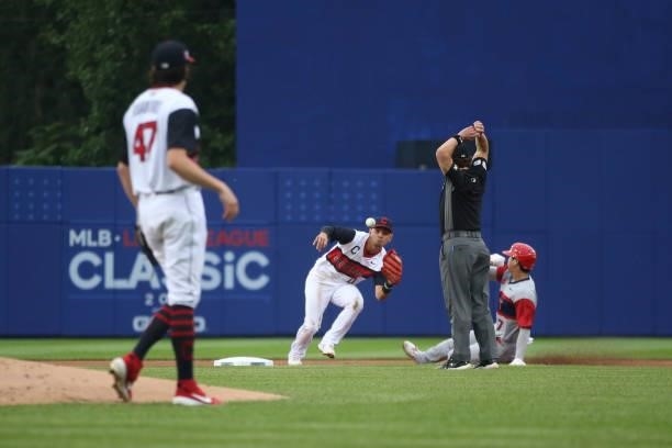 Andrés Giménez of the Cleveland Indians looks for the throw as Shohei Ohtani of the Los Angeles Angels slides into second during the game between the...