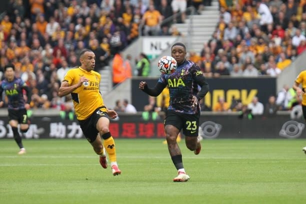 Steven Bergwijn of Tottenham Hotspur controls the ball ahead of Marçal of Wolverhampton Wanderers during the Premier League match between...
