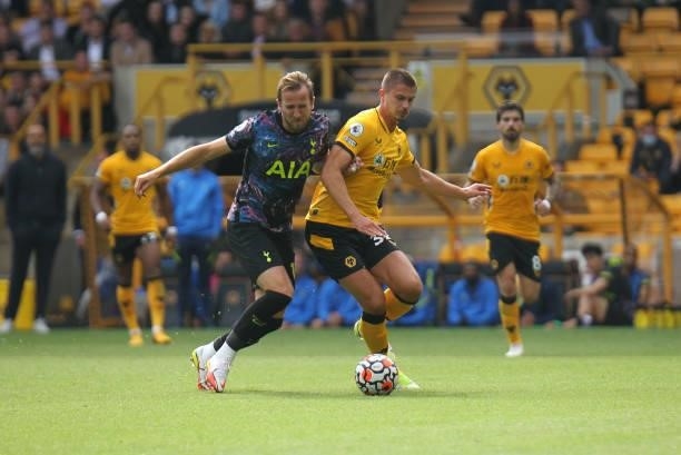 Harry Kane of Tottenham Hotspur in a tussle during the Premier League match between Wolverhampton Wanderers and Tottenham Hotspur at Molineux,...
