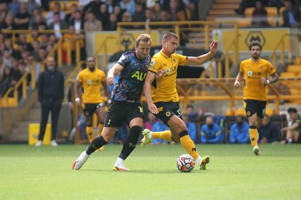 Harry Kane of Tottenham Hotspur races on to the ball during the Premier League match between Wolverhampton Wanderers and Tottenham Hotspur at...