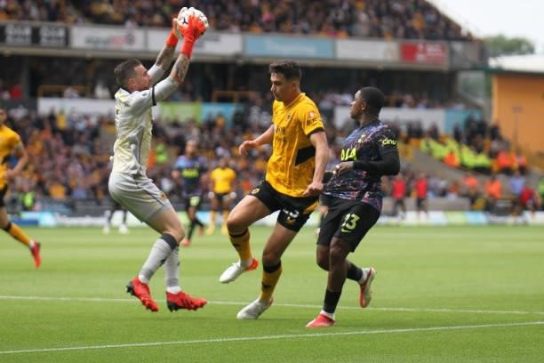 José Sá of Wolverhampton Wanderers collects the ball ahead of Steven Bergwijn of Tottenham Hotspur during the Premier League match between...