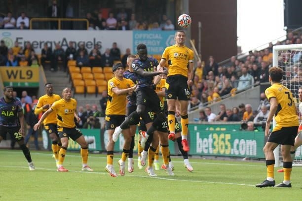 Conor Coady of Wolverhampton Wanderers heads in his box defending during the Premier League match between Wolverhampton Wanderers and Tottenham...