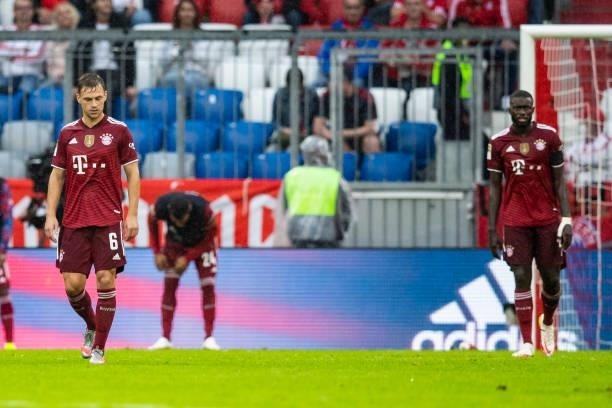 Joshua Kimmich of Bayern Muenchen, Corentin Tolisso of Bayern Muenchen and Dayot Upamecano of Bayern Muenchen looks dejected during the Bundesliga...