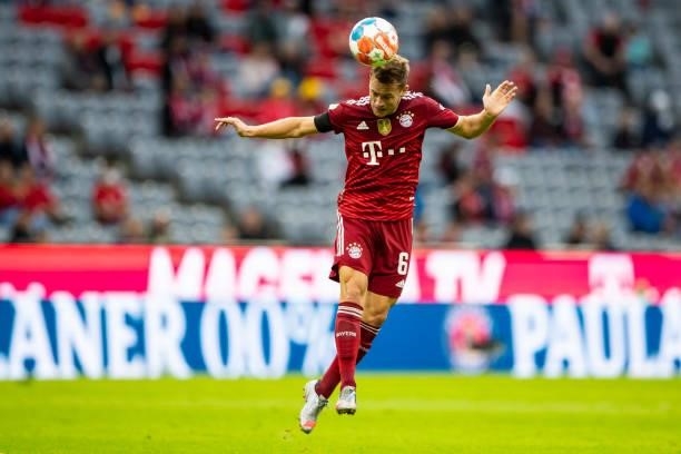 Joshua Kimmich of Bayern Muenchen compete during the Bundesliga match between FC Bayern Muenchen and 1. FC Koeln at Allianz Arena on August 22, 2021...