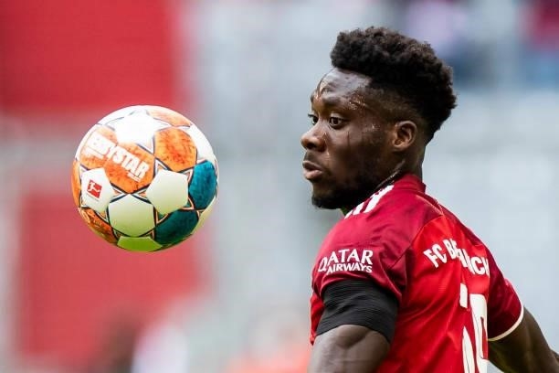 Alphonso Davies of Bayern Muenchen compete during the Bundesliga match between FC Bayern Muenchen and 1. FC Koeln at Allianz Arena on August 22, 2021...