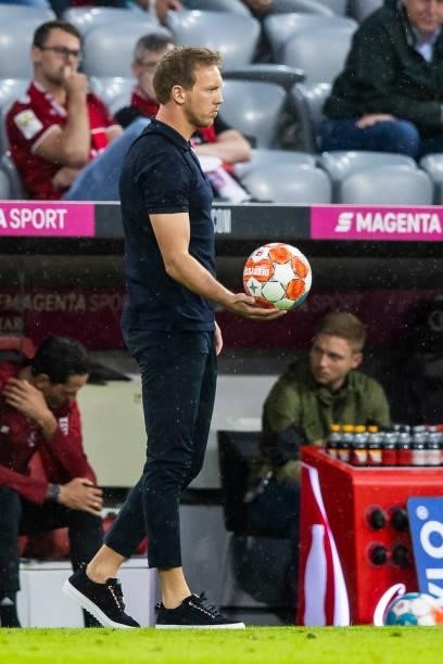 Head coach Julian Nagelsmann of Bayern Muenchen has the ball in his hand during the Bundesliga match between FC Bayern Muenchen and 1. FC Koeln at...