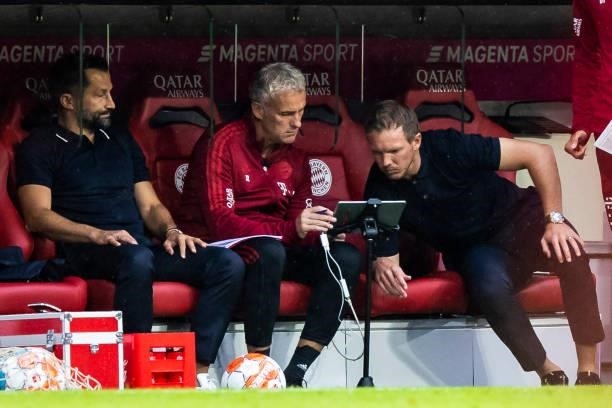 Head coach Julian Nagelsmann of Bayern Muenchen and chief of sport Hasan Salihamidzic of Bayern Muenchen on the bench during the Bundesliga match...