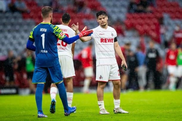 Goalkeeper Timo Horn of 1. FC Koeln and Jorge Mere of 1. FC Koeln looks dejected during the Bundesliga match between FC Bayern Muenchen and 1. FC...