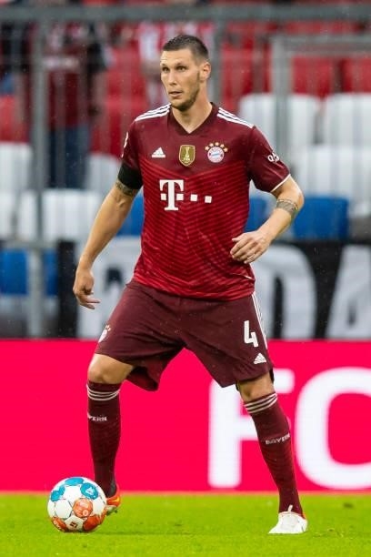 Niklas Suele of Bayern Muenchen compete during the Bundesliga match between FC Bayern Muenchen and 1. FC Koeln at Allianz Arena on August 22, 2021 in...