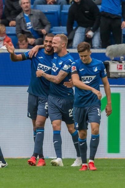 Kevin Akpoguma of TSG 1899 Hoffenheim celebrates after scoring his team's first goal with teammates during the Bundesliga match between TSG...