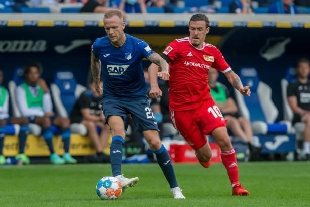 Kevin Vogt of TSG 1899 Hoffenheim and Max Kruse of 1.FC Union Berlin battle for the ball during the Bundesliga match between TSG Hoffenheim and 1. FC...