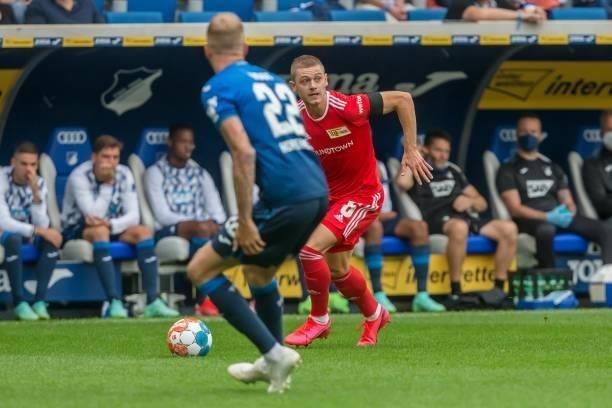 Kevin Vogt of TSG 1899 Hoffenheim and Julian Ryerson of 1.FC Union Berlin battle for the ball during the Bundesliga match between TSG Hoffenheim and...