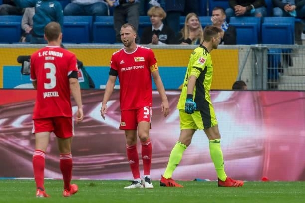Paul Jaeckel of 1.FC Union Berlin, Marvin Friedrich of 1.FC Union Berlin and goalkeeper Andreas Luthe of 1.FC Union Berlin looks dejected during the...