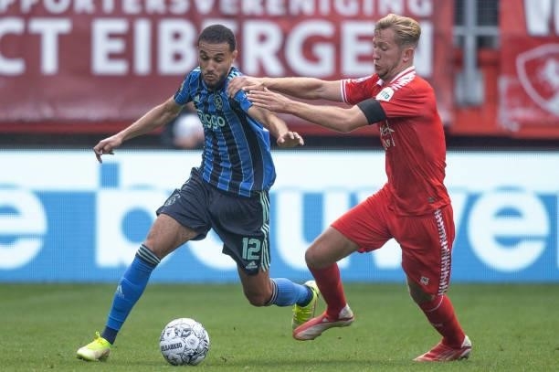 Noussair Mazraoui of AFC Ajax and Michel vlap of Rangers FC Battle for the ball during the Dutch Eredivisie match between FC Twente and Ajax at De...