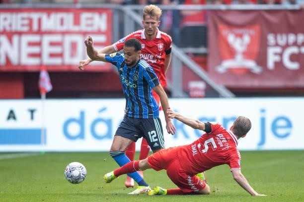 Noussair Mazraoui of AFC Ajax and Michel vlap of Rangers FC Battle for the ball during the Dutch Eredivisie match between FC Twente and Ajax at De...