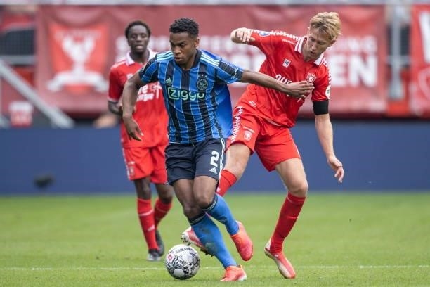 Jurrien Timber of AFC Ajax and Michel Vlap of Rangers FC Battle for the ball during the Dutch Eredivisie match between FC Twente and Ajax at De...