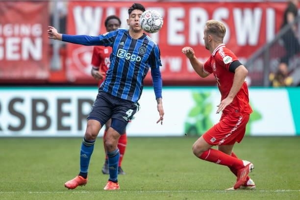 Edson Alvarez of AFC Ajax and Michel Sadilek of Rangers FC Battle for the ball during the Dutch Eredivisie match between FC Twente and Ajax at De...