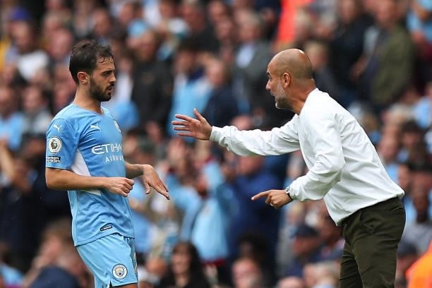 Bernardo Silva of Manchester City and Pep Guardiola the head coach / manager of Manchester City during the Premier League match between Manchester...
