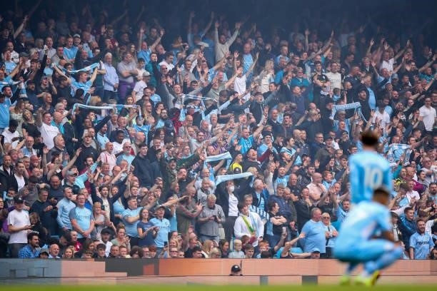 Fans of Manchester City during the Premier League match between Manchester City and Norwich City at Etihad Stadium on August 21, 2021 in Manchester,...