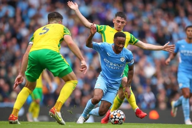 Billy Gilmour of Norwich City and Raheem Sterling of Manchester City during the Premier League match between Manchester City and Norwich City at...