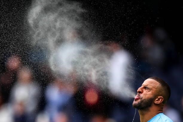 Kyle Walker of Manchester City spits water out of his mouth during the Premier League match between Manchester City and Norwich City at Etihad...