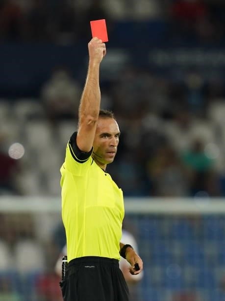 The referee shows red card to Aitor Fernandez of Levante UD during the La Liga match between Levante UD v Real Madrid played at Ciutat Valencia...