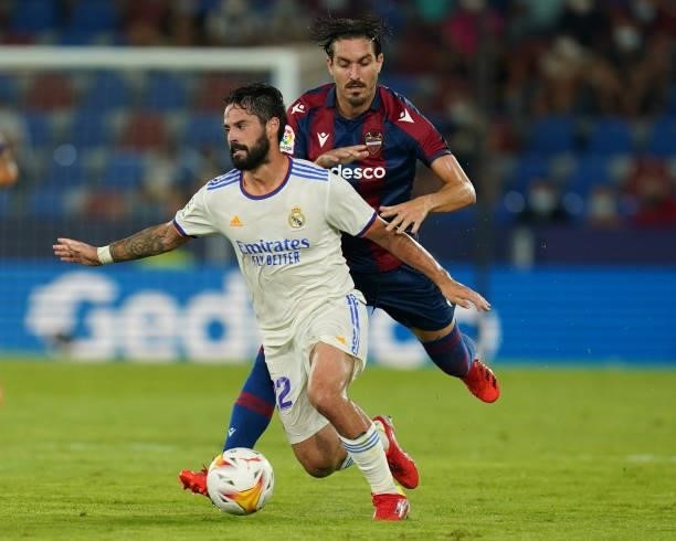 Isco Alarcon of Real Madrid and Jose Angel Campana of Levante UD during the La Liga match between Levante UD v Real Madrid played at Ciutat Valencia...