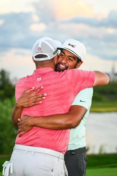 Jon Rahm of Spain hugs Tony Finau following Finaus playoff victory during the final round of THE NORTHERN TRUST, the first event of the FedExCup...