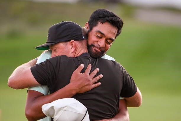 Tony Finau hugs his coach, Boyd Summerhays after winning in a playoff during the weather delayed final round of THE NORTHERN TRUST at Liberty...