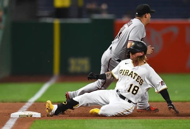 Ben Gamel of the Pittsburgh Pirates slides safely into third base after hitting a triple during the fifth inning against the Arizona Diamondbacks at...