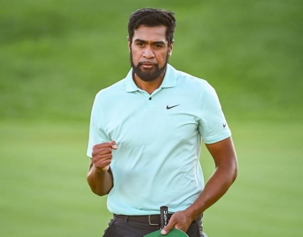 Tony Finau celebrates his playoff victory with a fist pump on the 18th hole green during the final round of THE NORTHERN TRUST, the first event of...
