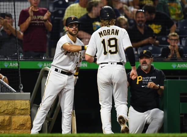 Colin Moran celebrates with Michael Chavis of the Pittsburgh Pirates after scoring in the fourth inning against the Arizona Diamondbacks at PNC Park...