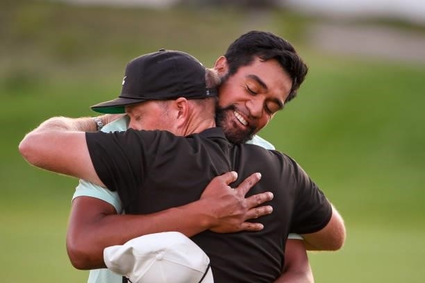 Tony Finau hugs his coach, Boyd Summerhays after winning in a playoff during the weather delayed final round of THE NORTHERN TRUST at Liberty...