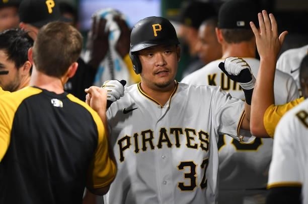 Yoshi Tsutsugo of the Pittsburgh Pirates celebrates with teammates after hitting a solo home run during the seventh inning against the Arizona...