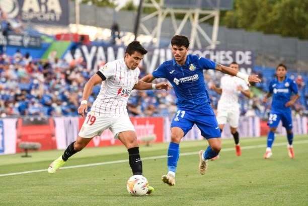 Marcos Acuna and Carles Alena during La Liga match between Getafe CF and Sevilla FC at Coliseum Alfonso Perez on August 23, 2021 in Getafe, Spain.
