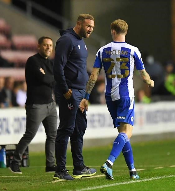 Bolton Wanderers' Manager Ian Evatt has words with Wigan Athletic's James McClean during the Carabao Cup Second Round match between Wigan Athletic...