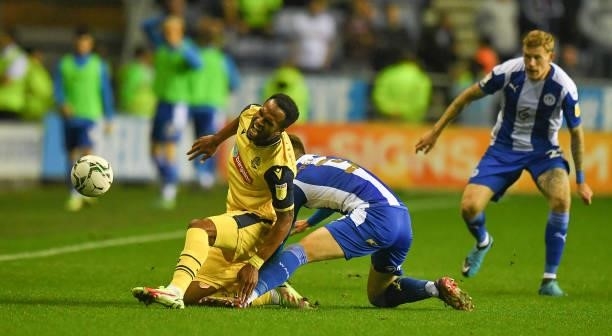 Bolton Wanderers' Nathan Delfouneso is fouled by Wigan Athletic's Tom Pearce during the Carabao Cup Second Round match between Wigan Athletic and...