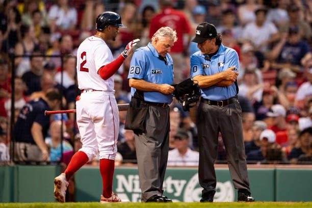 Home plate umpire Tom Hallion exits the game after an injury during the first inning of a game against the Minnesota Twins on August 24, 2021 at...