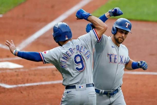 Nathaniel Lowe of the Texas Rangers celebrates his three-run home run off Eli Morgan of the Cleveland Indians with Isiah Kiner-Falefa in the first...