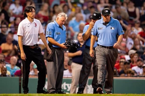 Home plate umpire Tom Hallion exits the game after an injury during the first inning of a game against the Minnesota Twins on August 24, 2021 at...