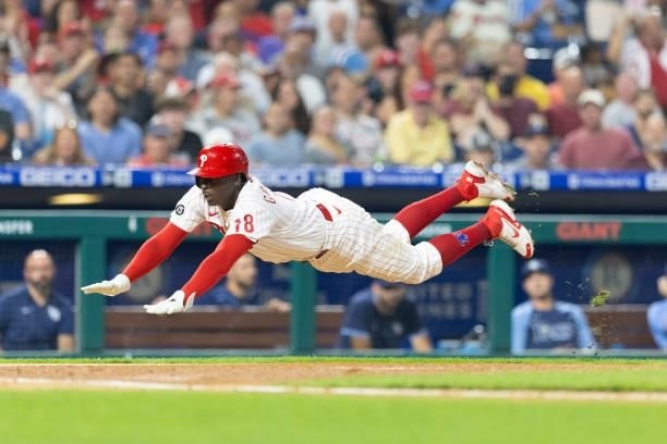 Didi Gregorius of the Philadelphia Phillies slides home safely in the bottom of the fourth inning against the Tampa Bay Rays at Citizens Bank Park on...