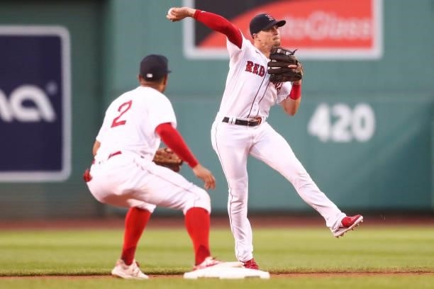 Enrique Hernandez of the Boston Red Sox throws to first base during the first inning of a game against the Minnesota Twins at Fenway Park on August...